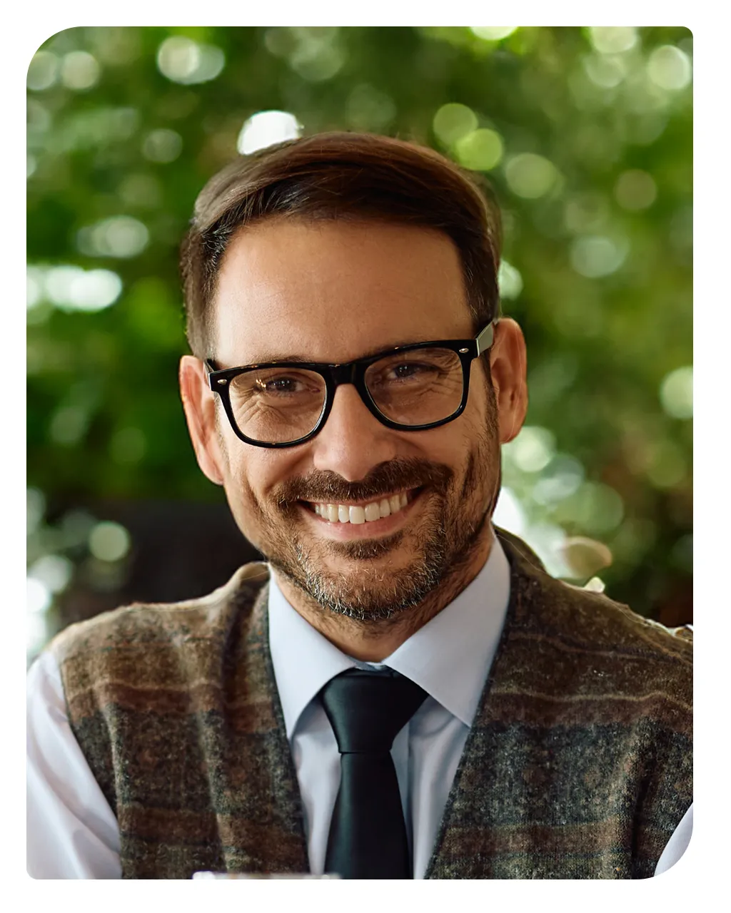 Smiling man wearing glasses and a kippah